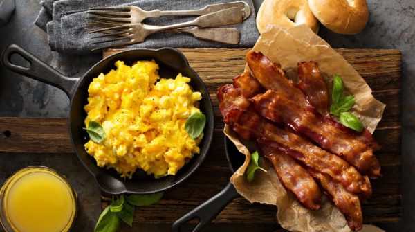 Big breakfast with bacon and scrambled eggs